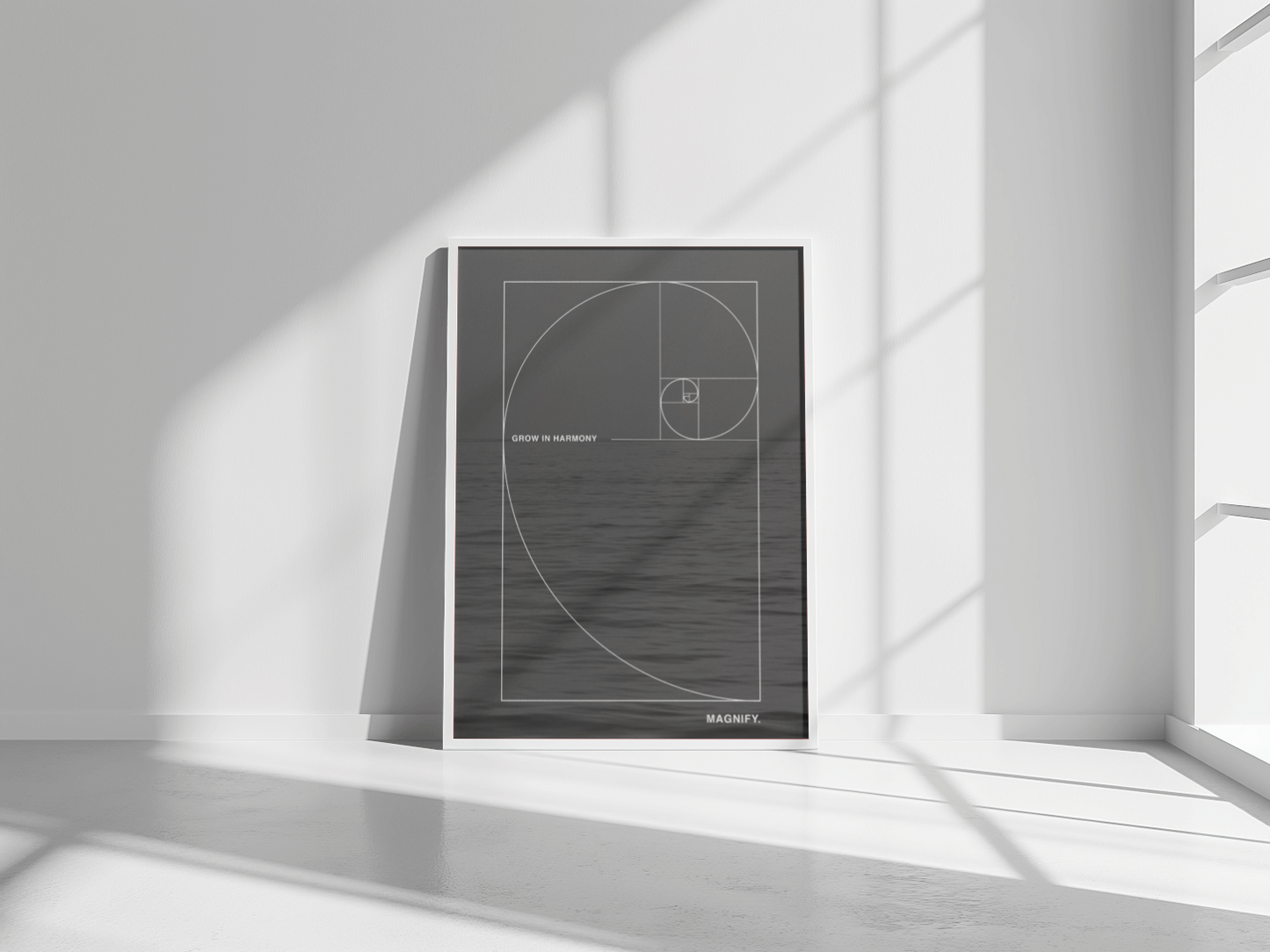 Framed artwork with geometric design on a white wall
