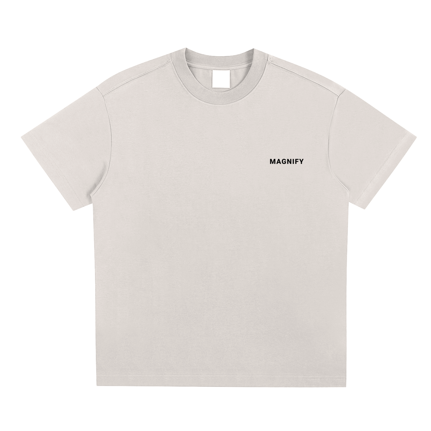Beige t-shirt with 'MAGNIFY' text on a white background
