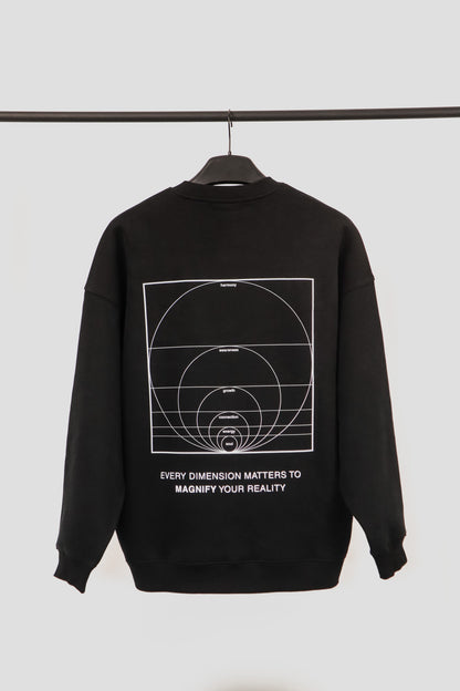 Black sweatshirt with white graphic design and text on a hanger against a light gray background