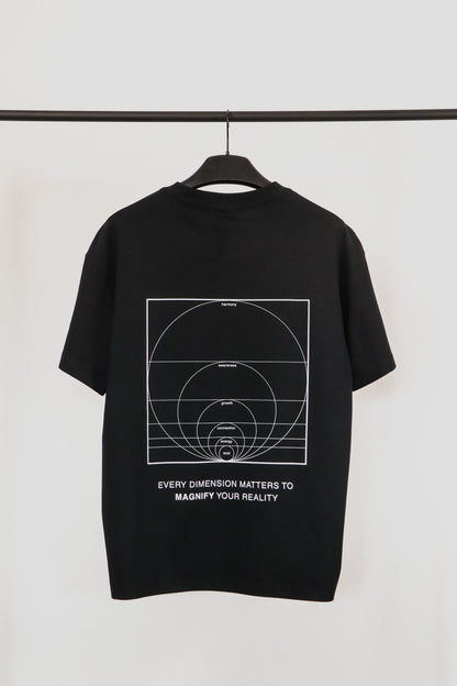 Black t-shirt with white graphic and text on a hanger against a white background