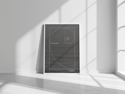 Framed artwork with geometric design on a white wall